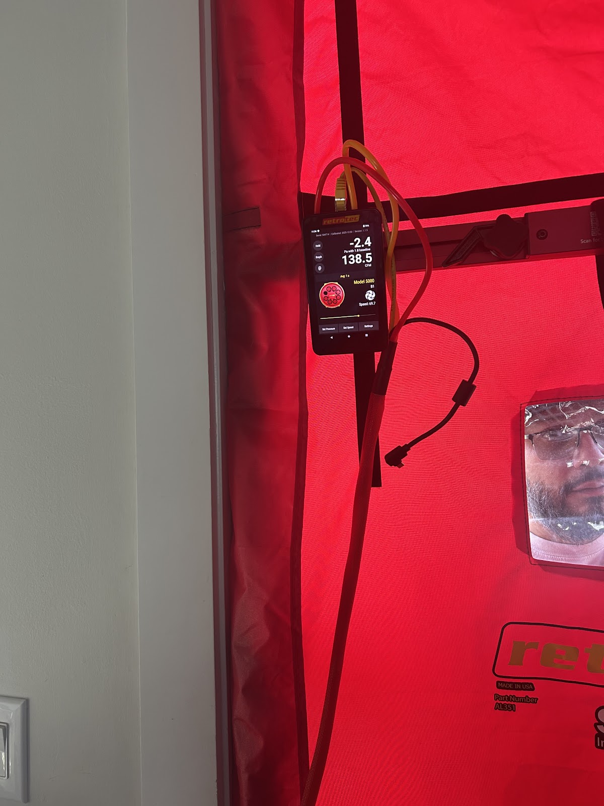 Blower door pressure test being conducted by Adam and Sons — 3rd party state-certified testing